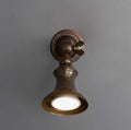 Antique brass finish swatch for Accra Traditional Small Brass Spotlight, showing a warm aged brass tone with subtle vintage patina.