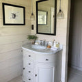 The Strand Bathroom small prismatic glass pendant light above white marble sink vanity in elegant bathroom