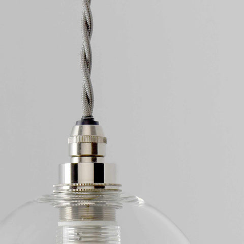 Small clear glass bathroom pendant light with silver metal fittings and adjustable braided cable