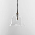 Bathroom pendant light with a clear glass shade and adjustable height, handcrafted and IP44-rated for safe bathroom use.
