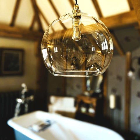 Soho Large Clear Glass Shade pendant light with modern bulb in rustic bathroom setting