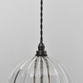 Soho medium ribbed glass shade bathroom pendant light with black twisted cord and clear textured glass shade
