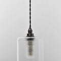Brook Small Ribbed Glass Shade pendant light with handblown cylindrical ribbed glass design and black twisted cord for bathroom lighting