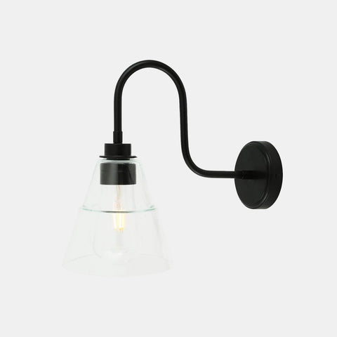 Kairi Bathroom Wall Light with swan neck design, black metal arm, and clear glass shade for warm, stylish lighting