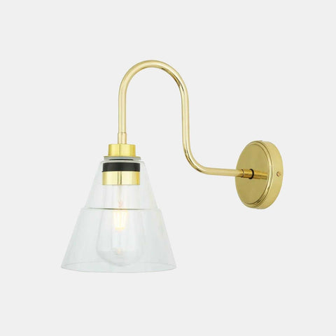 Kairi Bathroom Wall Light with swan neck design, clear glass shade, and brass finish for elegant, water-resistant bathroom lighting