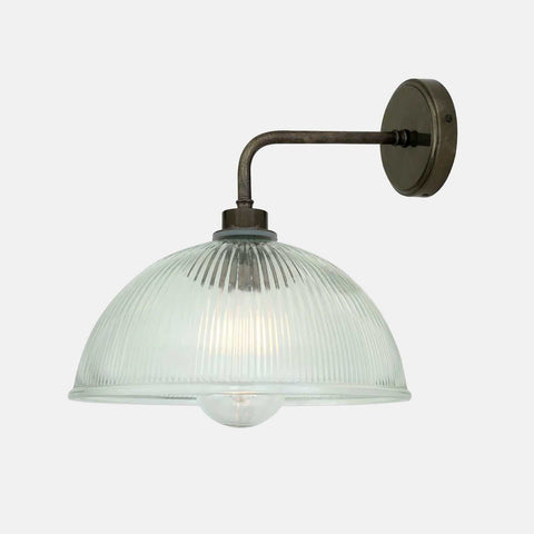 Maris Bathroom Wall Light with straight arm, prismatic glass shade, and rustic metal finish, suitable for wet environments.