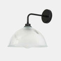 Maris Bathroom Wall Light with straight black arm and clear prismatic glass shade for ambient lighting
