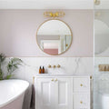 Clayton Bathroom Double Well Wall Light with modern industrial design above round mirror in stylish bathroom interior