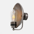 Chulainn Bathroom Dish Wall Light with antique silver finish, curved arm, glass bulb cover, and round dish shade for moisture-prone areas