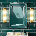 Pooky Long Roddy bathroom wall lights with gold finish and glass rods flanking a rectangular mirror on teal tiled wall