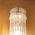 Pooky Long Roddy bathroom wall light with sleek glass rods and warm diffused glow, IP44 rated for bathroom use.