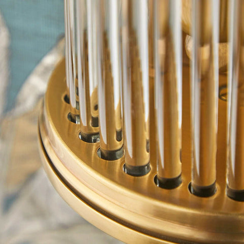 Close-up of Baby Roddy Bathroom wall light with brass finish and clear glass rods in Art Deco style