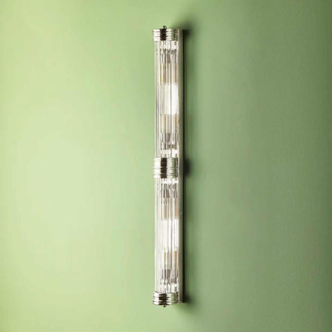 Pooky Rodtastic Bathroom Wall Light in nickel finish mounted on green wall, sleek modern double-length design ideal for bathroom vanity lighting