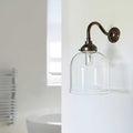 Hythe small clear glass shade bathroom wall light with antique bronze fixture and exposed bulb