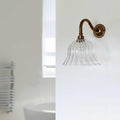 Bodium Small Ribbed Glass Shade Bathroom Wall Light with bronze fixture and elegant hand-blown ribbed glass shade