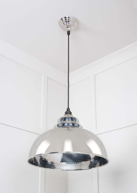 Brampton Hammered Nickel Pendant Light with hammered nickel finish and domed shape hanging in modern interior