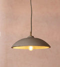 Corleone Concrete Pendant Light solid grey concrete curved hemisphere pendant light hanging over modern dining table