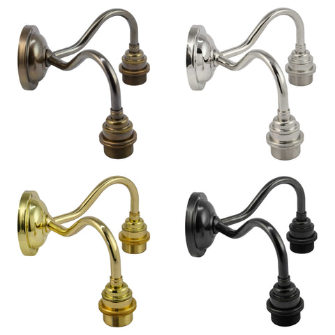 Four Langton Ceramic Shade Wall Light fixtures in bronze, chrome, brass, and matte black finishes without shades.
