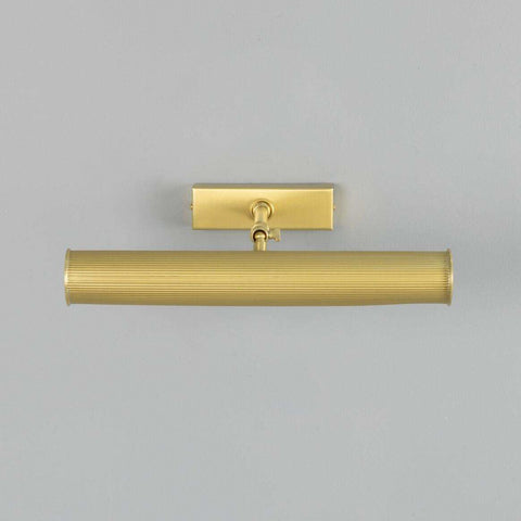 Cambridge Adjustable Brass Picture Light in antique brass finish illuminating framed artwork