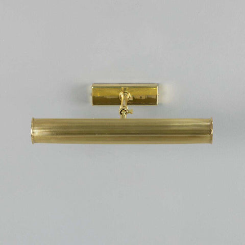 Cambridge Adjustable Brass Picture Light in reeded solid brass with adjustable arm and warm finish illuminating artwork