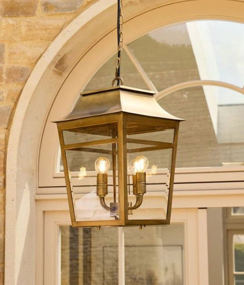 Majorelle Outdoor Pendant Light in brass in an outdoor space