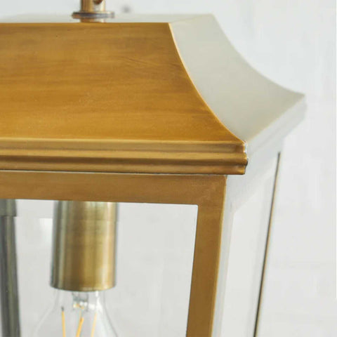Close-up of Pooky Crail Lantern outdoor ceiling light with solid brass frame and beveled glass panels