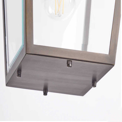 Close-up of Pooky Crail Lantern outdoor ceiling light with solid brass frame and beveled glass panels
