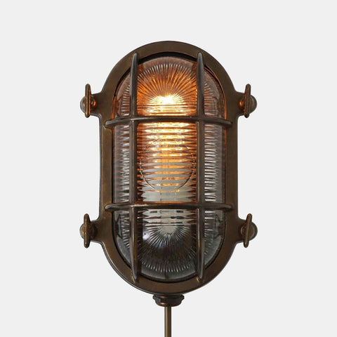 Ruben Small Outdoor Wall Light with nautical design, weatherproof metal and glass casing, and industrial marine bulkhead style.