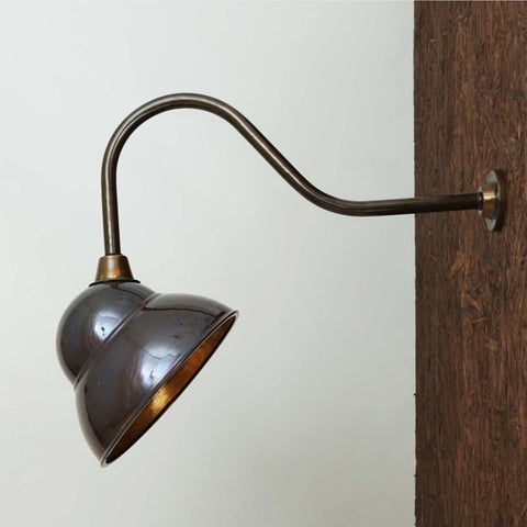 Fairburn IP23 Wall Light with curved metal arm and retro cap-style lamp mounted on wooden exterior wall
