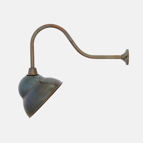 Fairburn IP23 Wall Light with a curved metal arm and retro cap-style brass shade for outdoor use