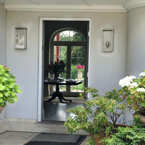 Chiswick Outdoor Wall Light large modern sleek design mounted on exterior wall near garden and entrance door