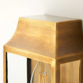 Close-up of Pooky Crail Wall Light solid brass outdoor lantern with warm golden finish