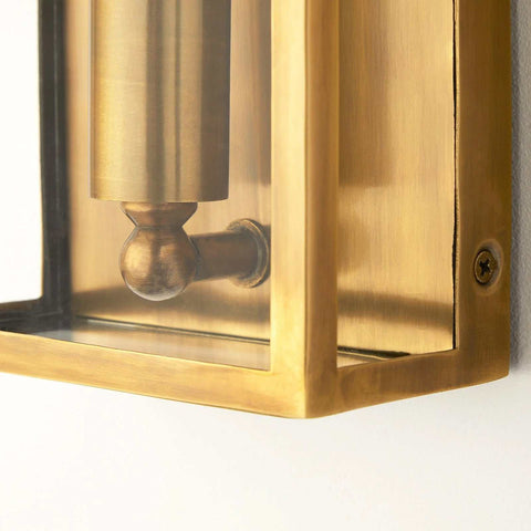 Close-up of Pooky Crail Wall Light in solid brass with lantern-inspired design and weatherproof finish