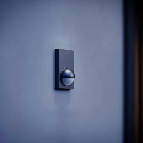 Outdoor motion sensor PIR Steinel Sensor IS-180 mounted on wall in low light environment