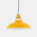 Yellow Vienna Pendant Light with industrial design and exposed bulb hanging from twisted black cord