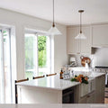 Rebell Prismatic Glass Pendant Light with prismatic shade hanging over modern kitchen island providing soft, glare-free illumination.