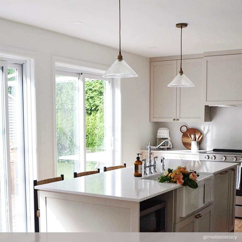 Rebell Prismatic Glass Pendant Light with prismatic shade hanging over modern kitchen island providing soft, glare-free illumination.