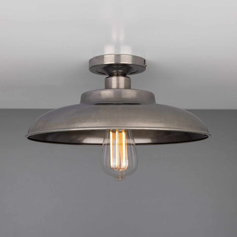 Telal Flush Ceiling Light with industrial vintage design and exposed bulb, ideal for low ceilings and modern interiors.