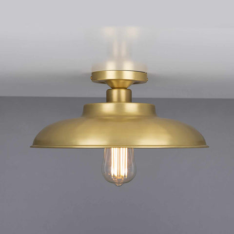 Telal Flush Ceiling Light with vintage industrial design in brushed brass finish and exposed bulb, ideal for low ceilings and modern interiors