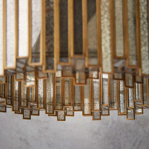 Close-up of Pooky Melvillous Chandelier pendant light with intricate mercerised glass and gold accents in art deco style