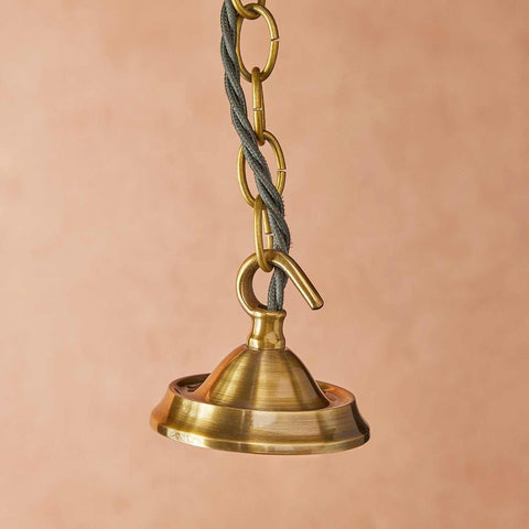Pooky Stella Star Pendant ceiling light with brass finish and clear glass shade hanging from chain
