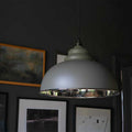 Brampton Grey Pendant Light with domed shape and polished nickel interior hanging in modern industrial style room