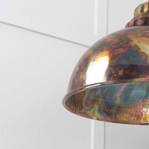 Brampton burnished pendant light with hand-burnished brass finish and hammered interior providing warm, textured glow.
