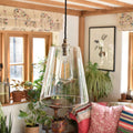 Newbury Large Clear Glass Shade pendant light with tapered glass design hanging in cozy living room setting