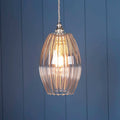Camber medium ribbed glass shade pendant light with fluted design hanging against blue wall background
