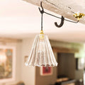 Rye Ribbed Pendant Light with fluted clear glass shade hanging from black cord and brass fixture in modern interior