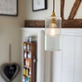 Brook Small Ribbed Glass Shade pendant light with adjustable flex, handblown ribbed glass, and brass fixture in vintage interior setting