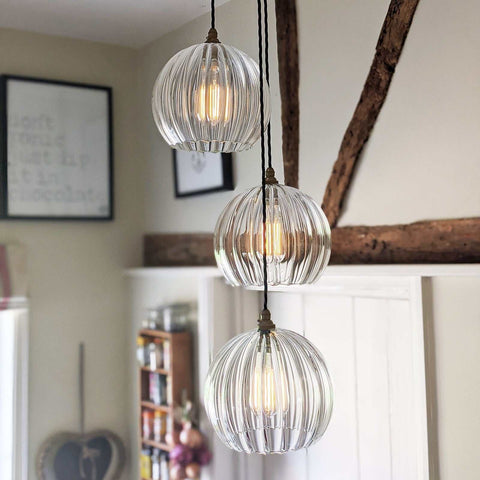 Soho large ribbed glass shade cluster pendant light with adjustable hanging cords in a modern living room setting