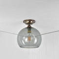 Soho Medium Smoked Glass Shade flush ceiling light with a smoked glass globe and antique brass finish, suitable for low ceilings.