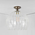 Soho Extra Large Ribbed Glass Globe flush ceiling light with hand-blown ribbed glass and antique brass fittings